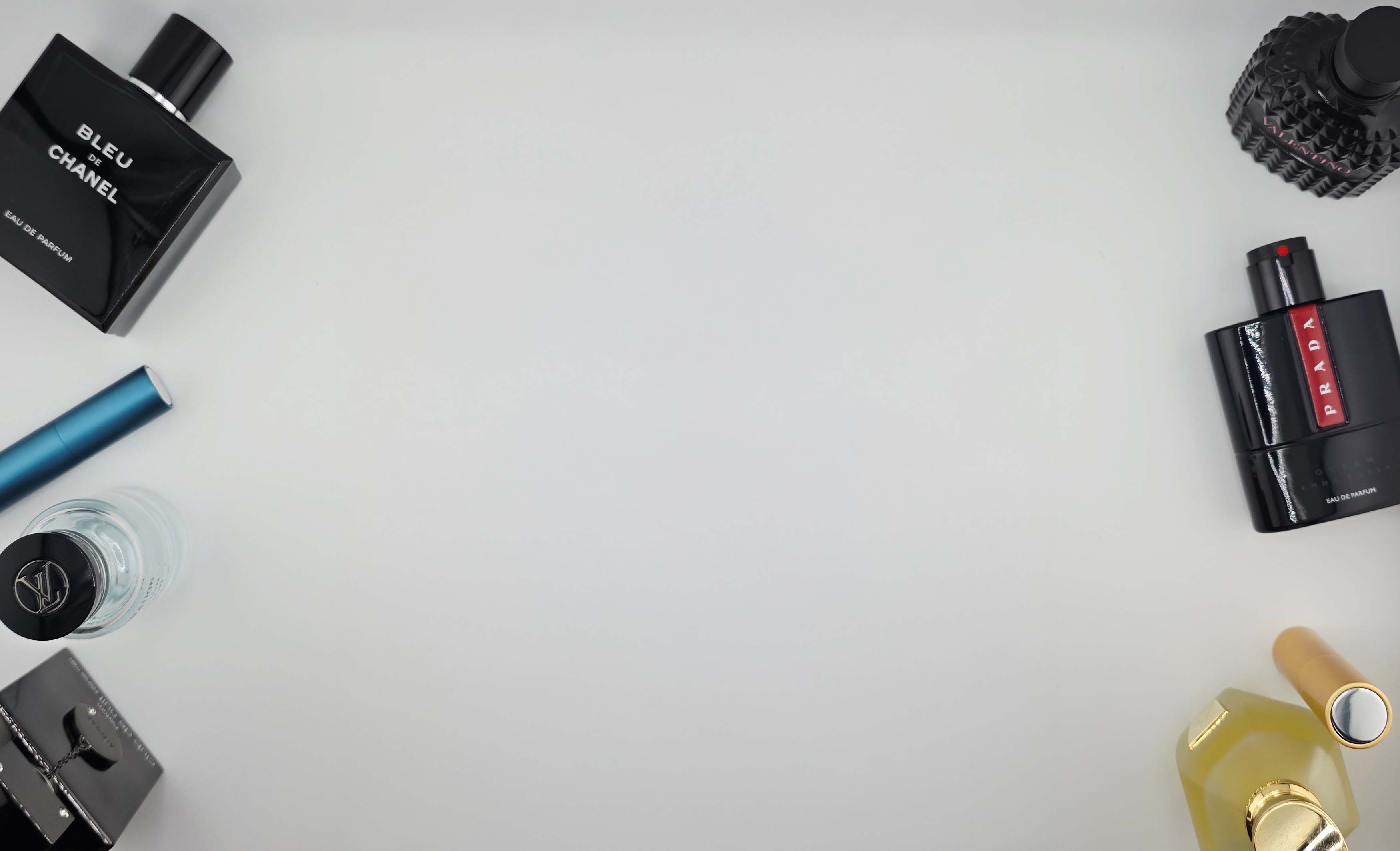 Collection of perfume bottles on a light gray background