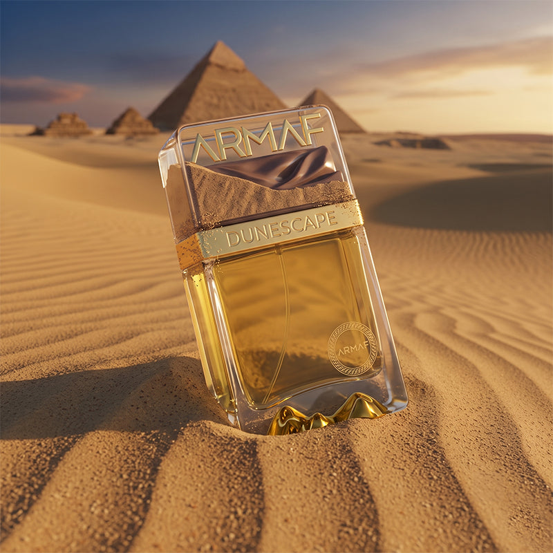 Armaf Dunescape Fragrance Bottle with Pyramids in Background