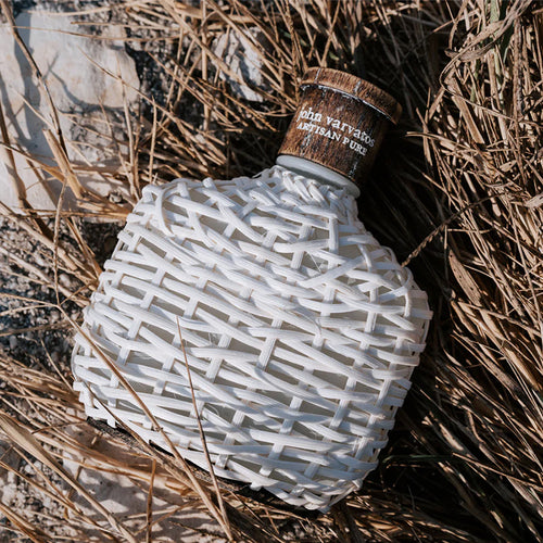 John Varvatos Artisan Pure Fragrance Bottle in a Natual Scenery
