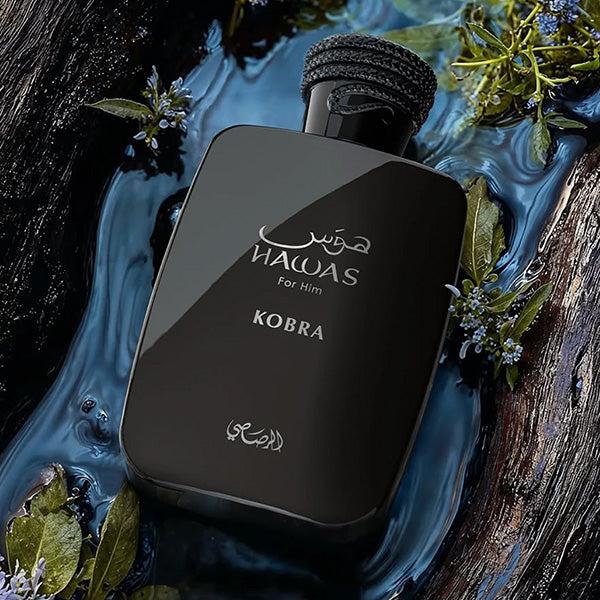 Rasasi Hawas Kobra Bottle in Water Puddle with Moss and Wood