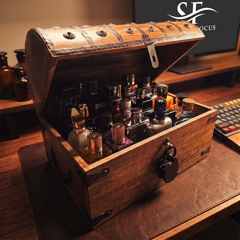 A wooden treasure chest displaying a vetted private collection of authentic designer and niche fragrance at Scent Focus, Premium Fragrance Storage.