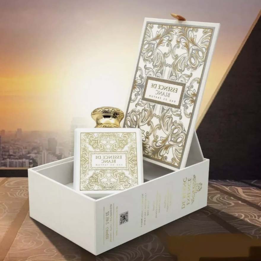 Essence de Blanc perfume by Fragrance World displayed in luxury box with gold detailing at sunset