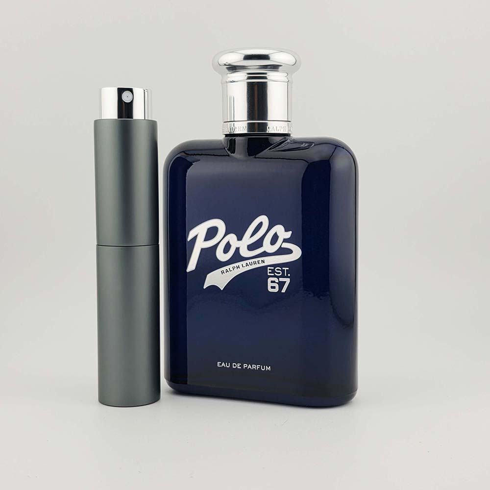 Polo 67 by Ralph Lauren EDP bottle next to a gray decant atomizer on white background.